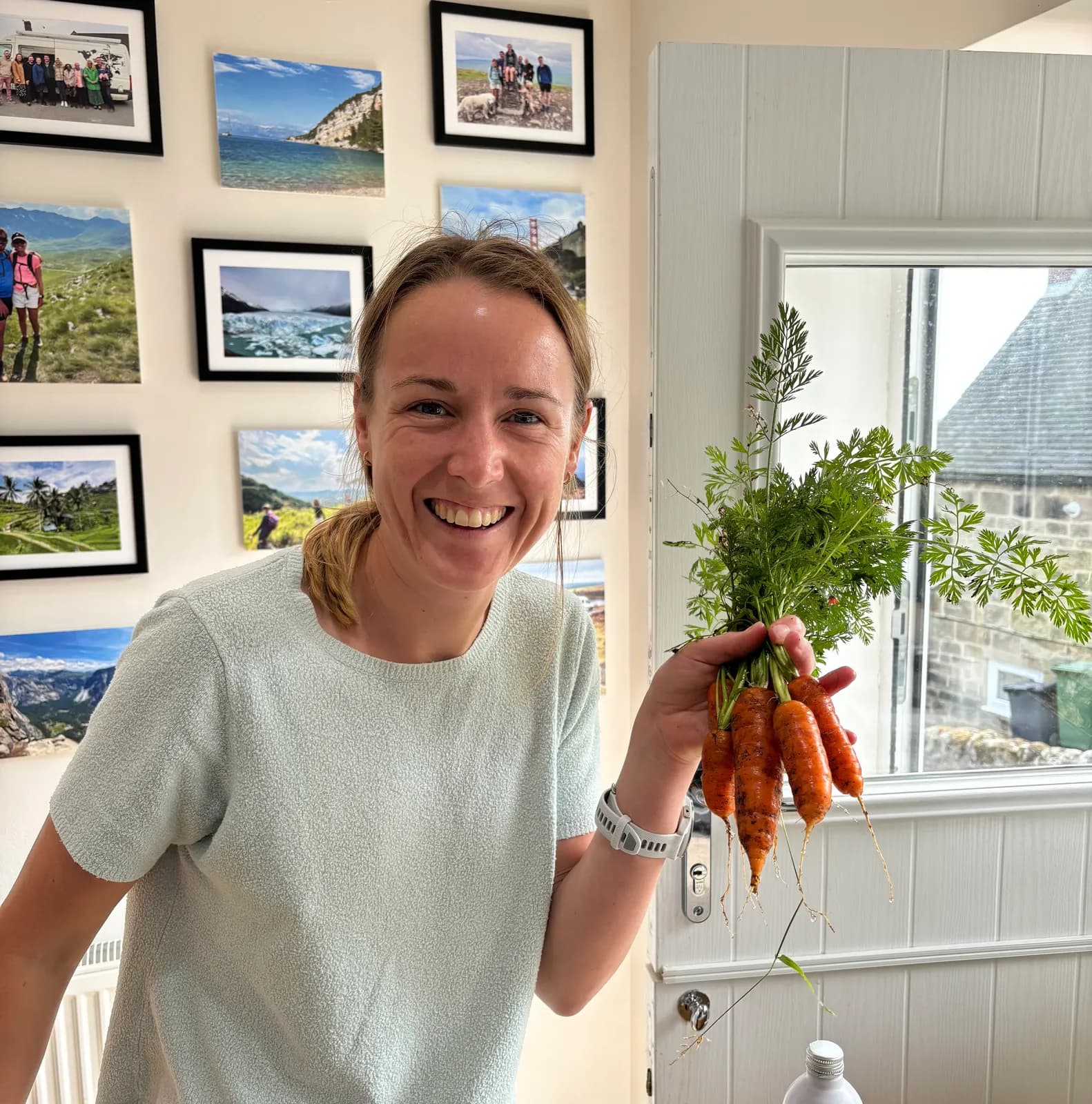 Josie with a bunch of carrots